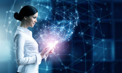 Woman with Tablet in Futuristic Background