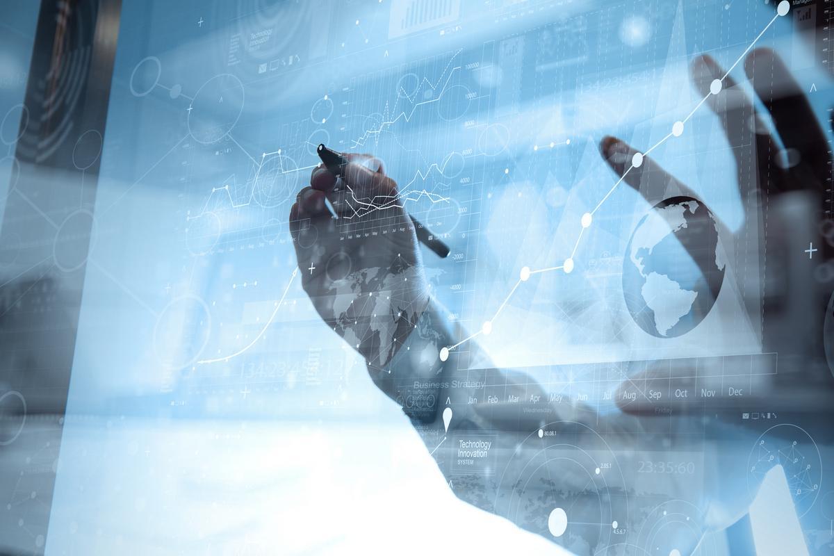 Man working on digital technology chart