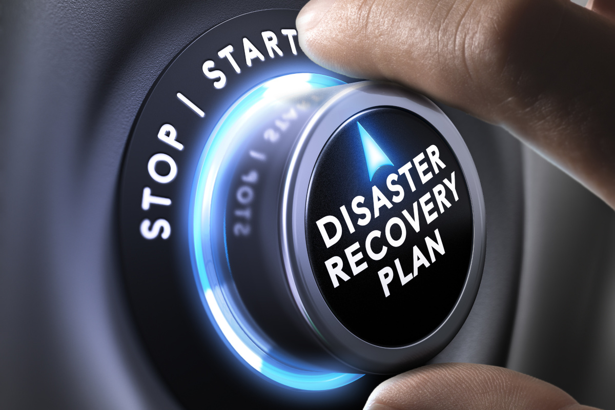 Man turning Disaster Recovery button