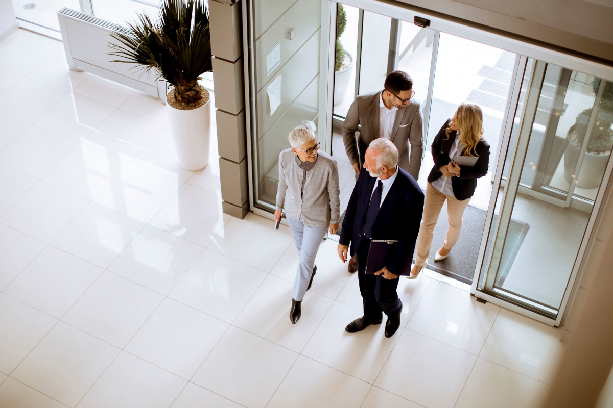 People walting into a building