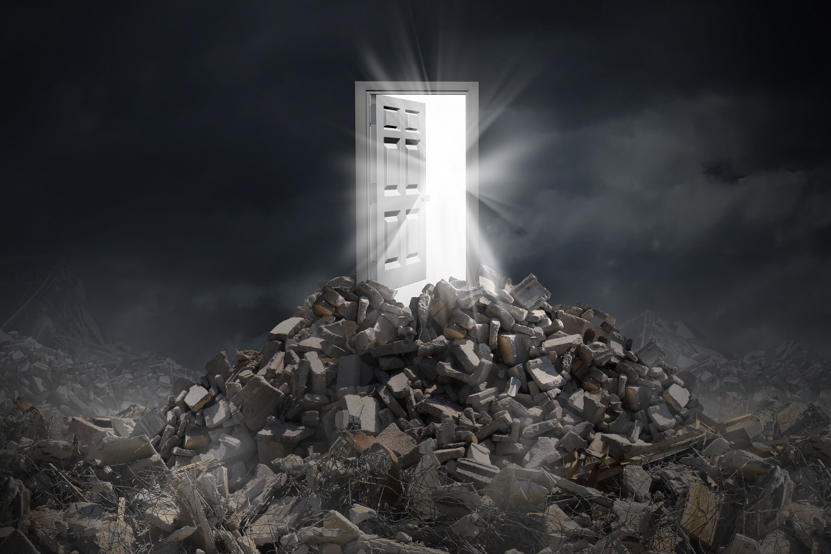 Open Door Emitting Light Atop Pile of Rubble, Disaster Recovery, Business Continuity, Data Backup and Protection Concept